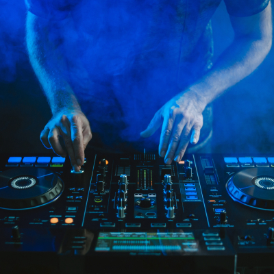 62WsGmHiL0PY4PxQPPvTJC-closeup-dj-working-blue-light.jpg image 3